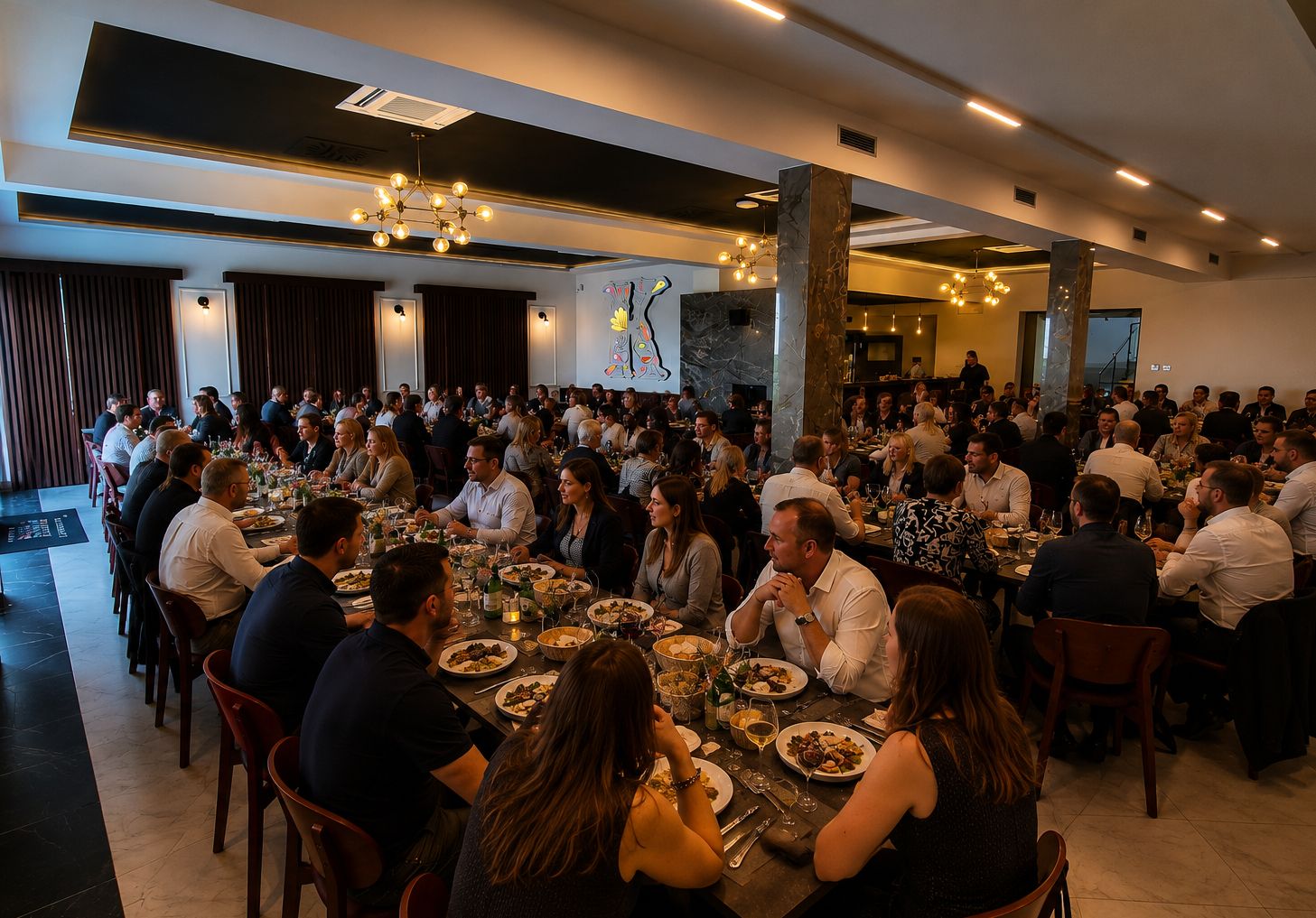 Long tables in the Klub Kornel restaurant, full of guests